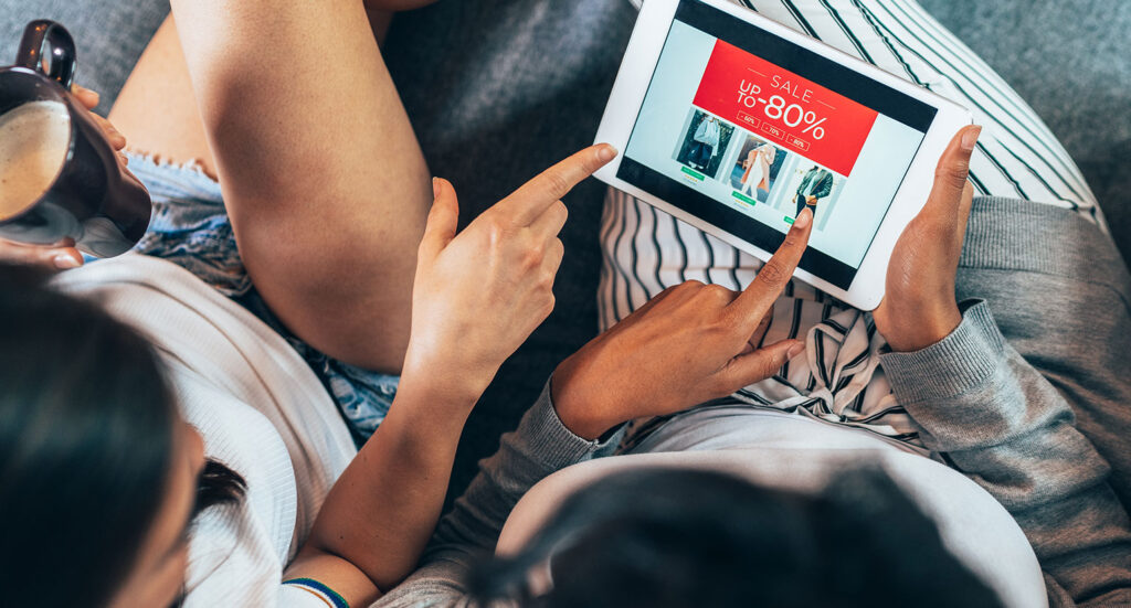 Women online shopping on tablet
