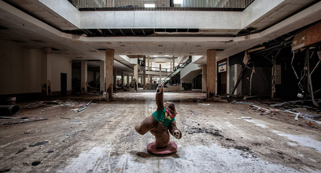 stuffed teddy bear in abandoned shopping centre
