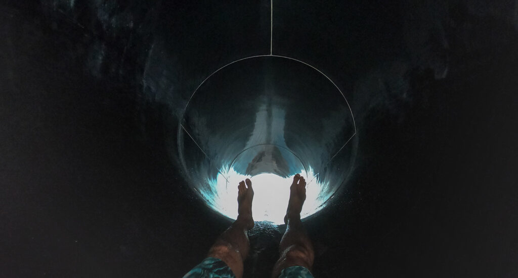 Feet heading down a tunnel