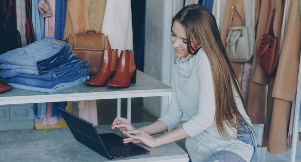 Photo of young woman using her laptop - online shopping